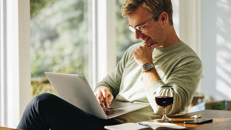 hero man laptop wine athome