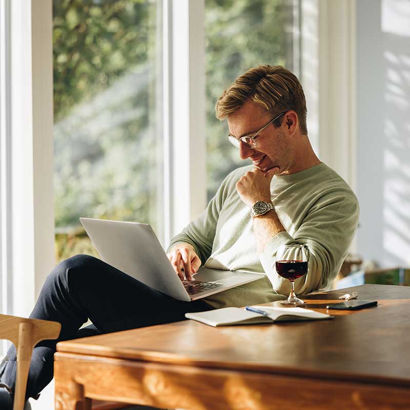 hero man laptop wine athome