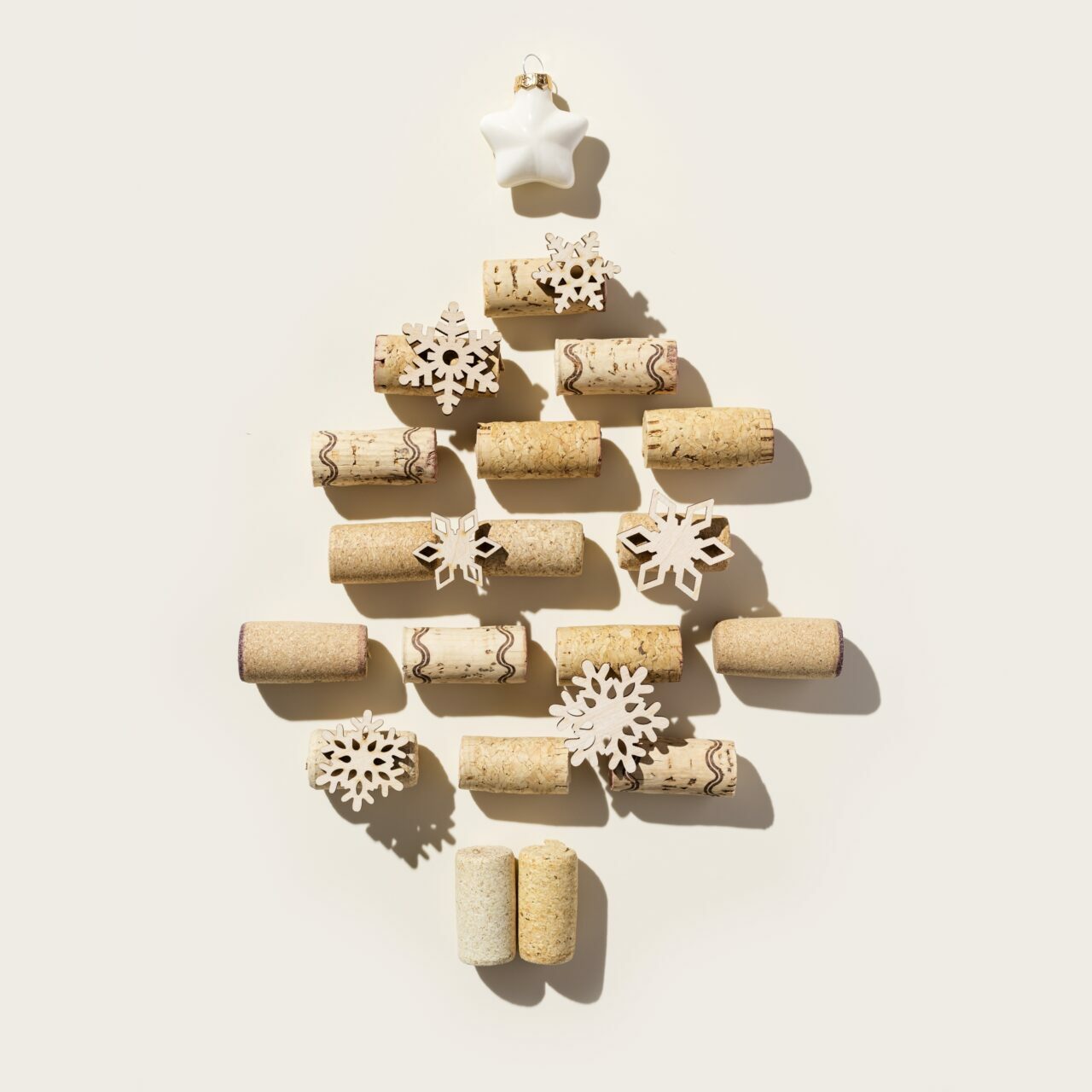 wine,corks,as,christmas,tree,on,beige,background,,sun,shadows.
