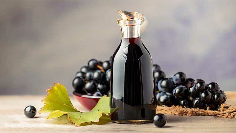 glass bottle of organic black grape balsamic vinegar